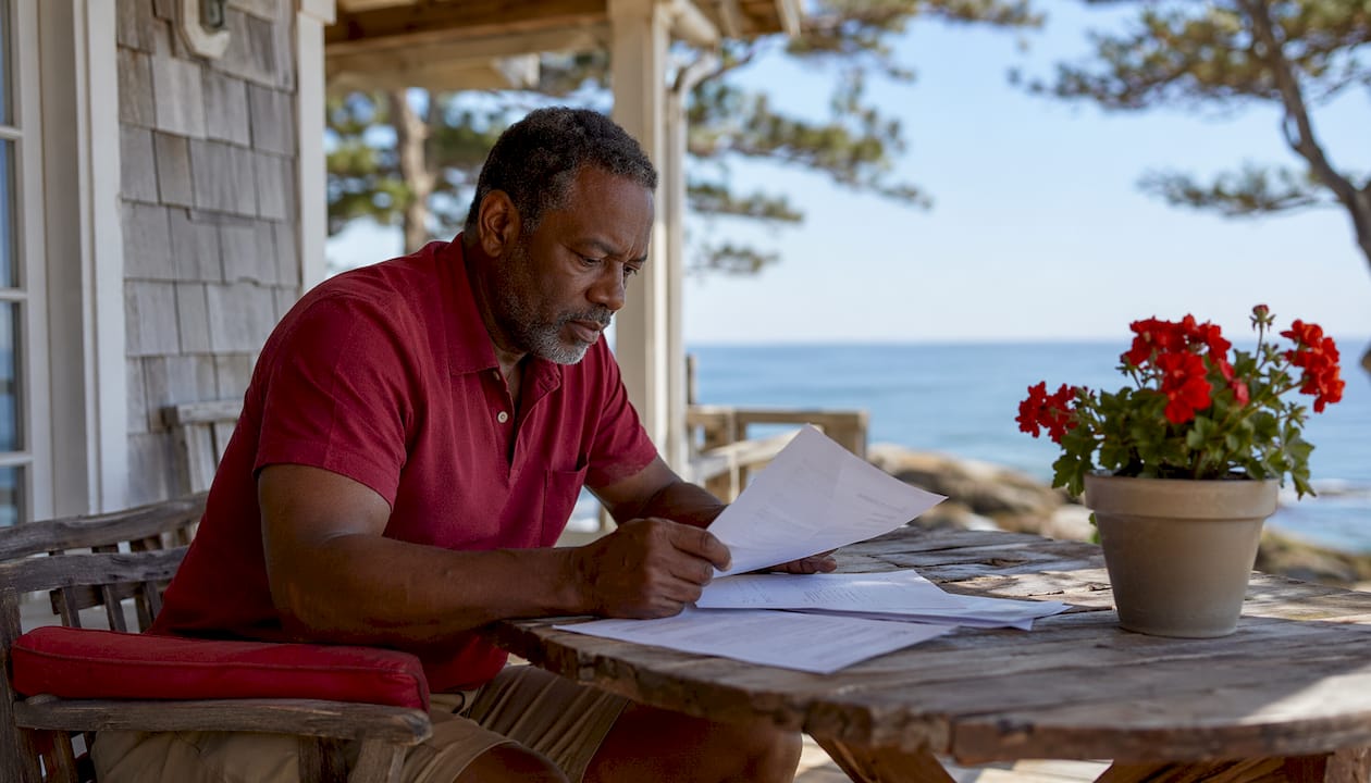 Man reviewing boat ownership documents