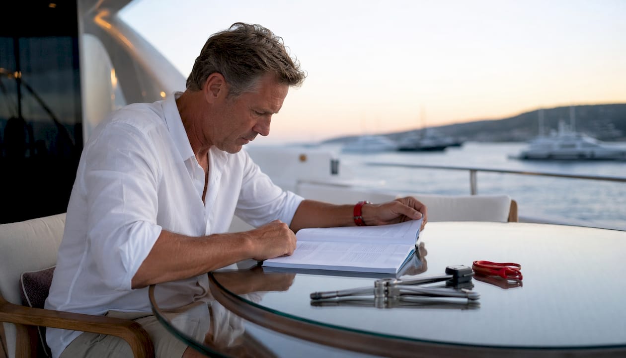 Buyer reviewing new build yacht contract
