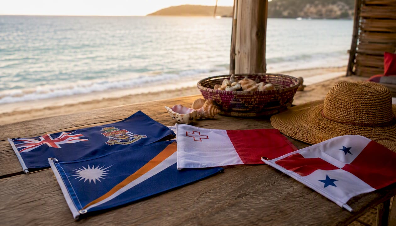 Collection of international yacht flags on table