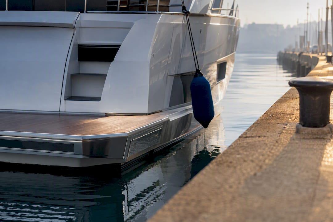 Anonymous yacht stern at European customs quay
