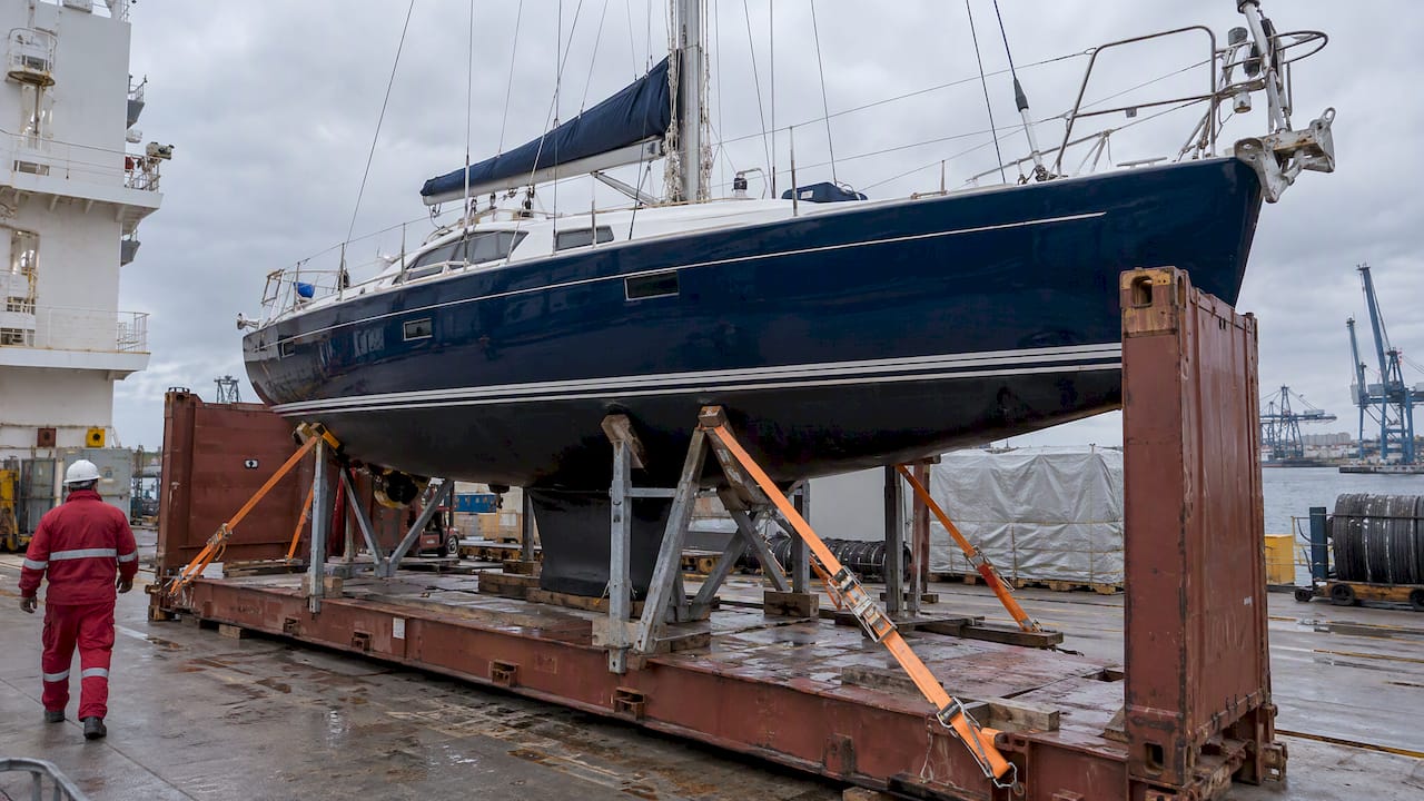 Yacht secured on a cargo vessel flat-rack